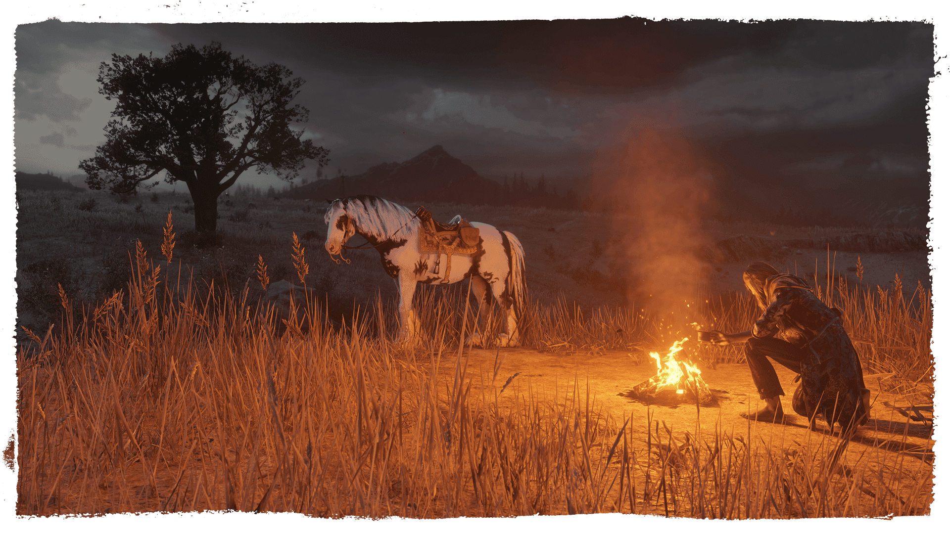 Woman crouched by fire with horse in the plains